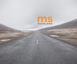Road with MS Auckland logo